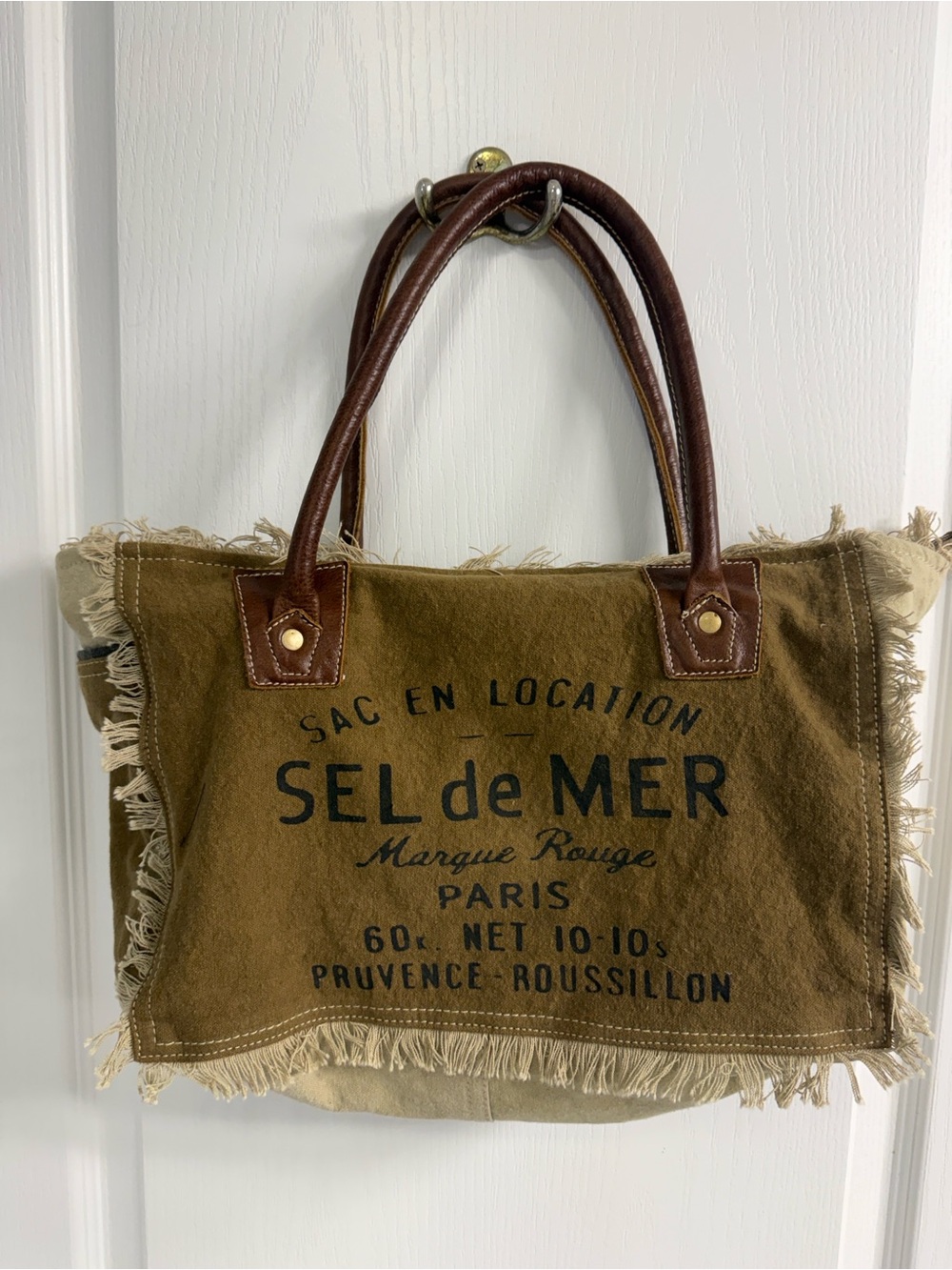 Myra Bag Sel de Mer small canvas tote, featuring distressed frayed edges